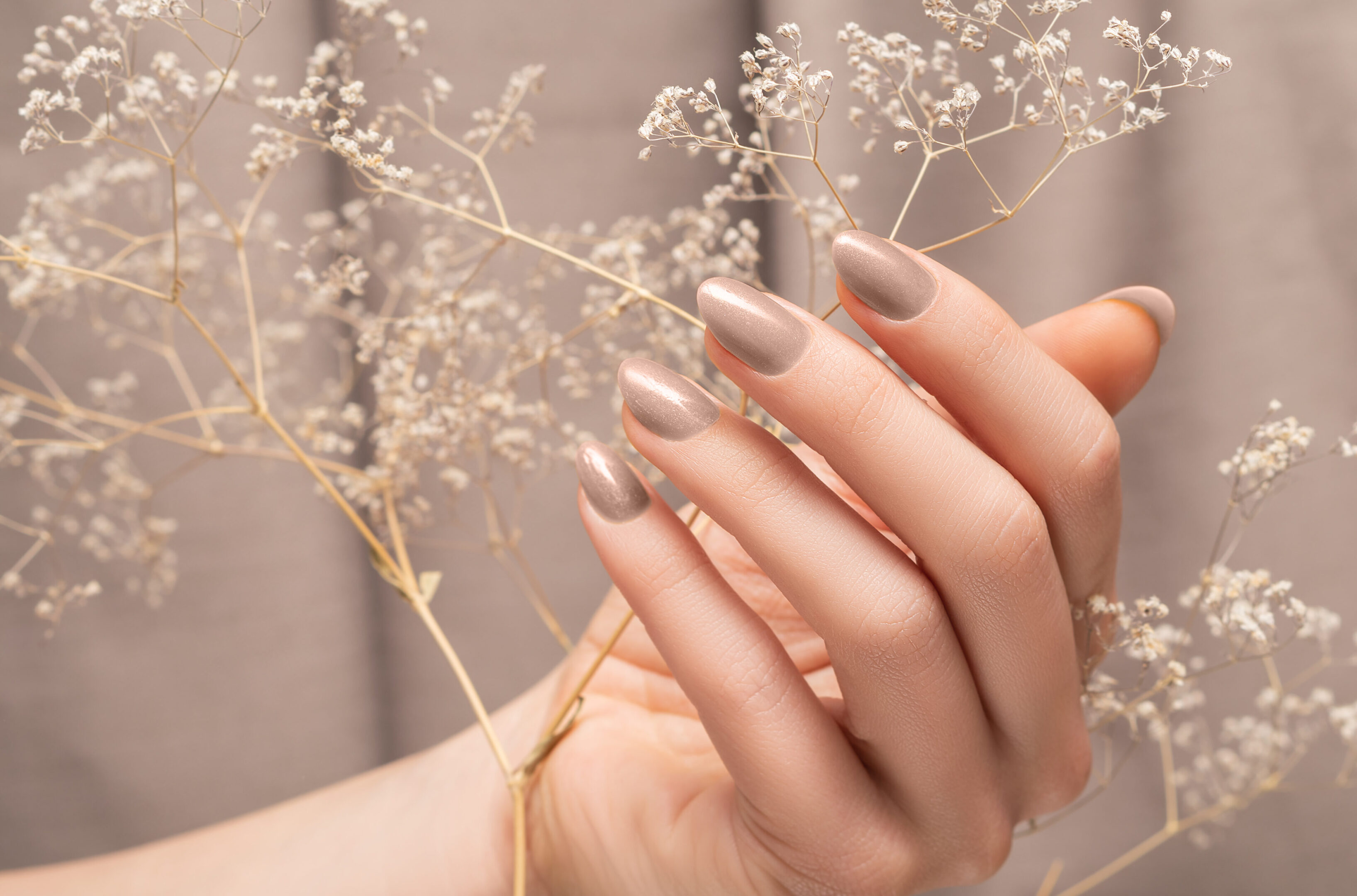 Female,Hand,With,Glitter,Beige,Nail,Design.,Female,Hand,Hold